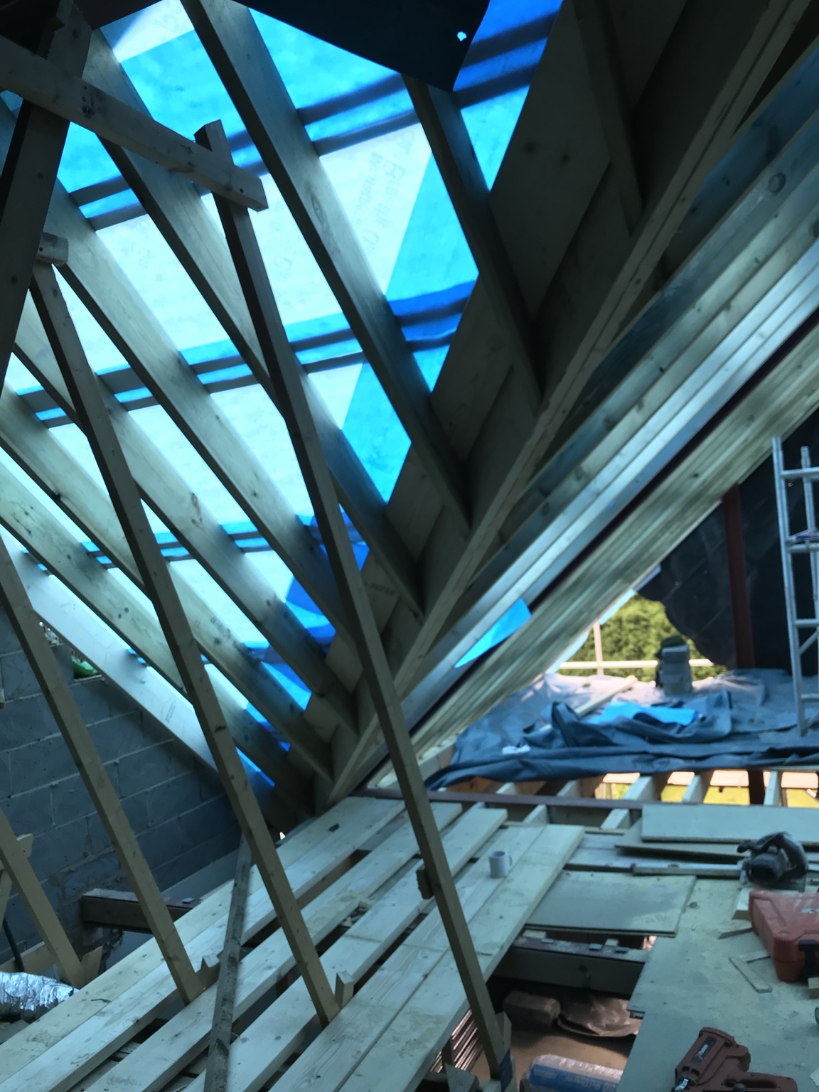 View beneath the new timber roof structure during the conversion