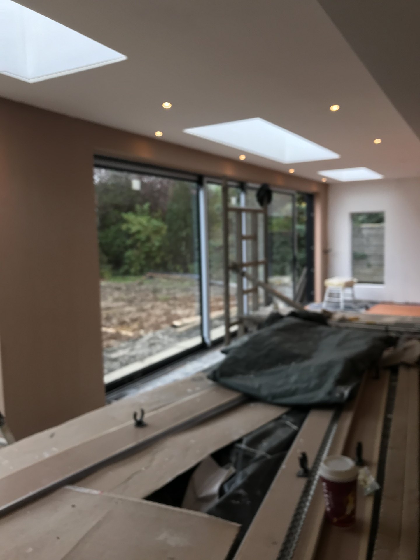 Bright extension interior with rooflights and full-height glazing — Rear Double Extension, Ellenbrook, Worsley